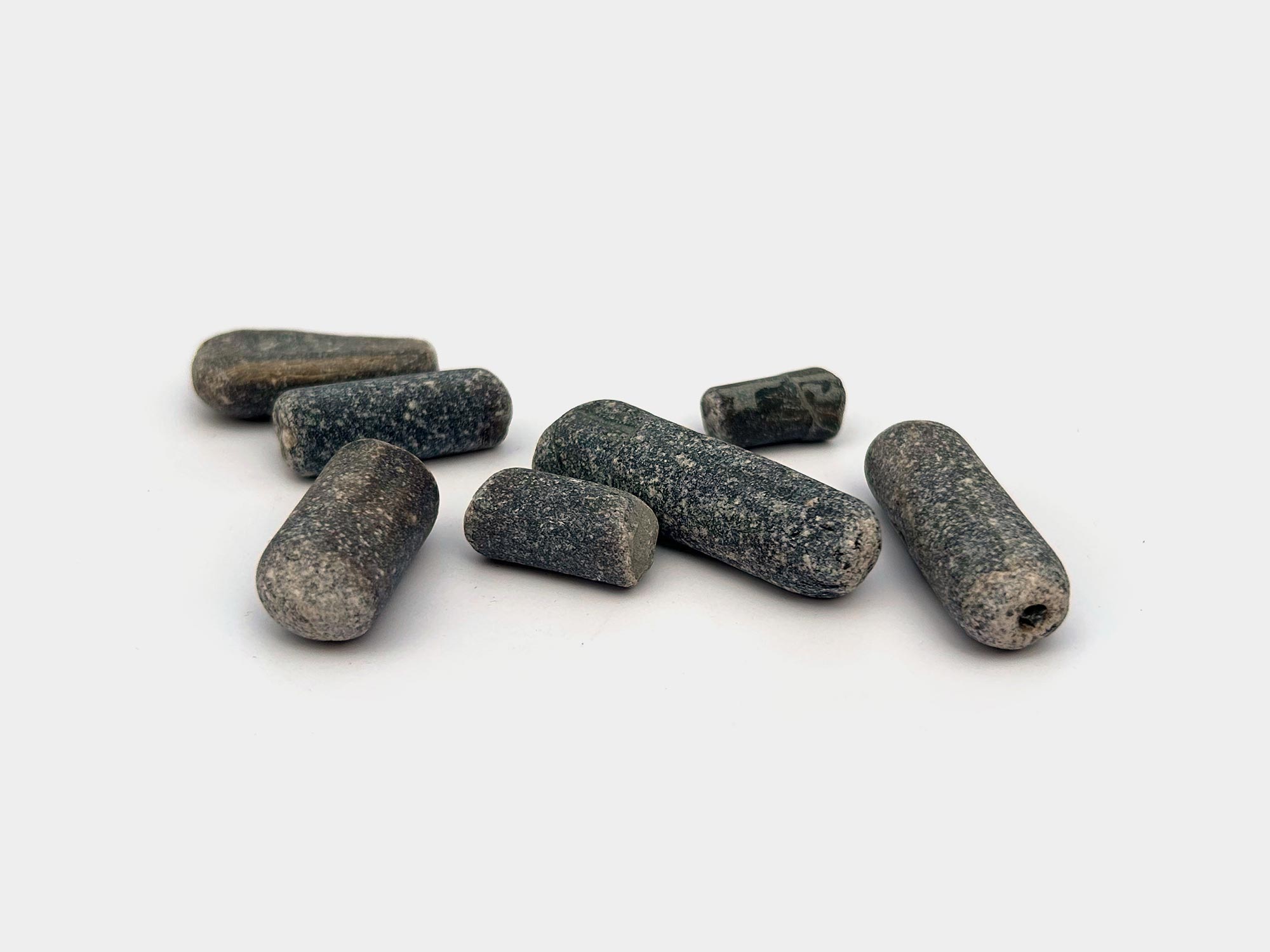 Multiple belemnite guards. Found on Charmouth beach, Dorset, England. August 2024